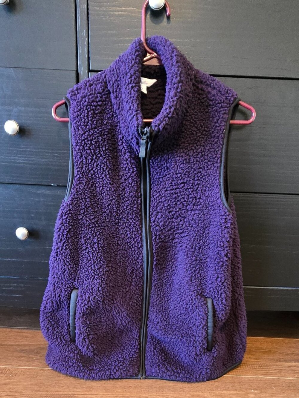Purple fleece vest with black zipper and pockets, size L (12-14)